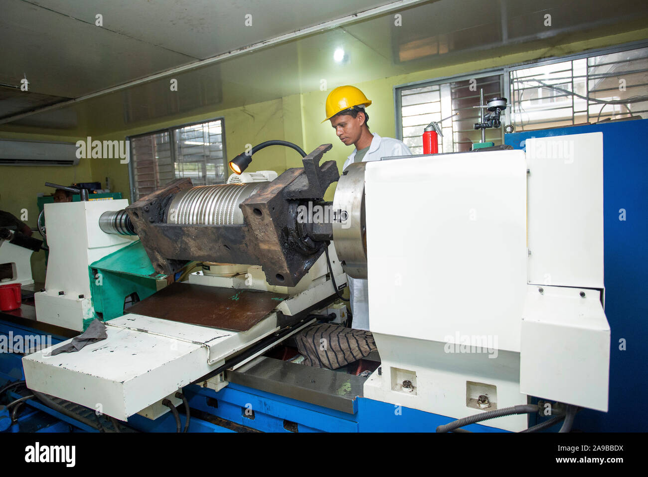 Bangladesh May 20, 2015 A factory lab operator using Steel rod