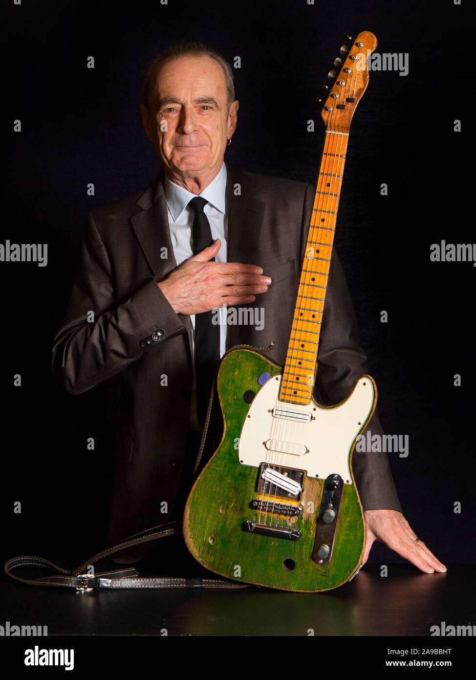 Status Quo frontman Francis Rossi OBE with his green Fender Telecaster in London. Stock Photo