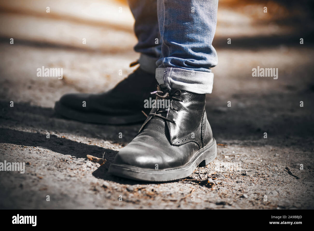 New trainers on a man wearing blue jeans Stock Photo - Alamy