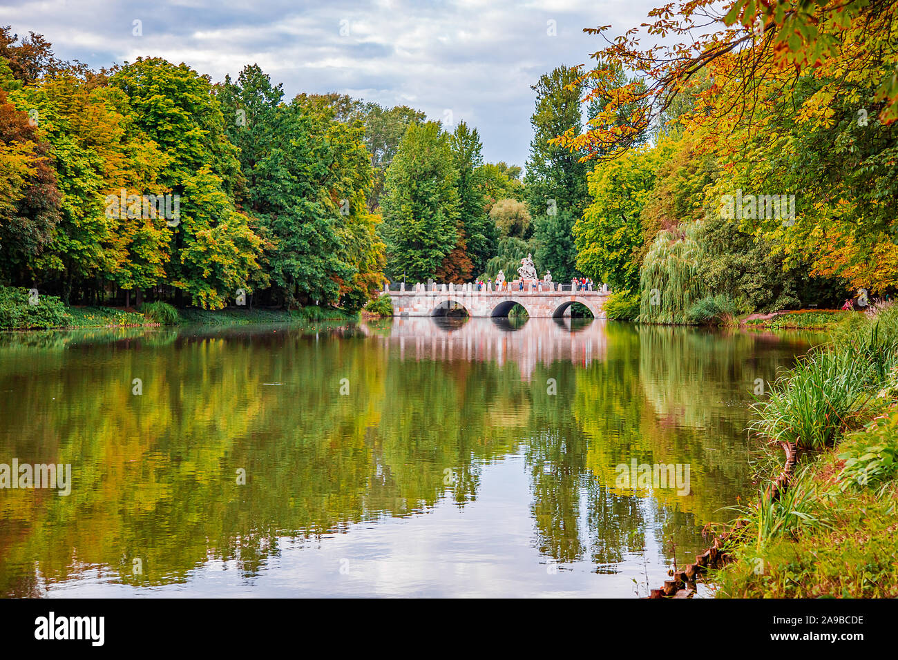 Bridge in the park on the lake. Royal Palace on the Water in Lazienki