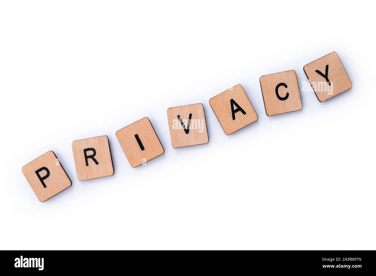 The word PRIVACY, spelt with wooden letter tiles over a white ...