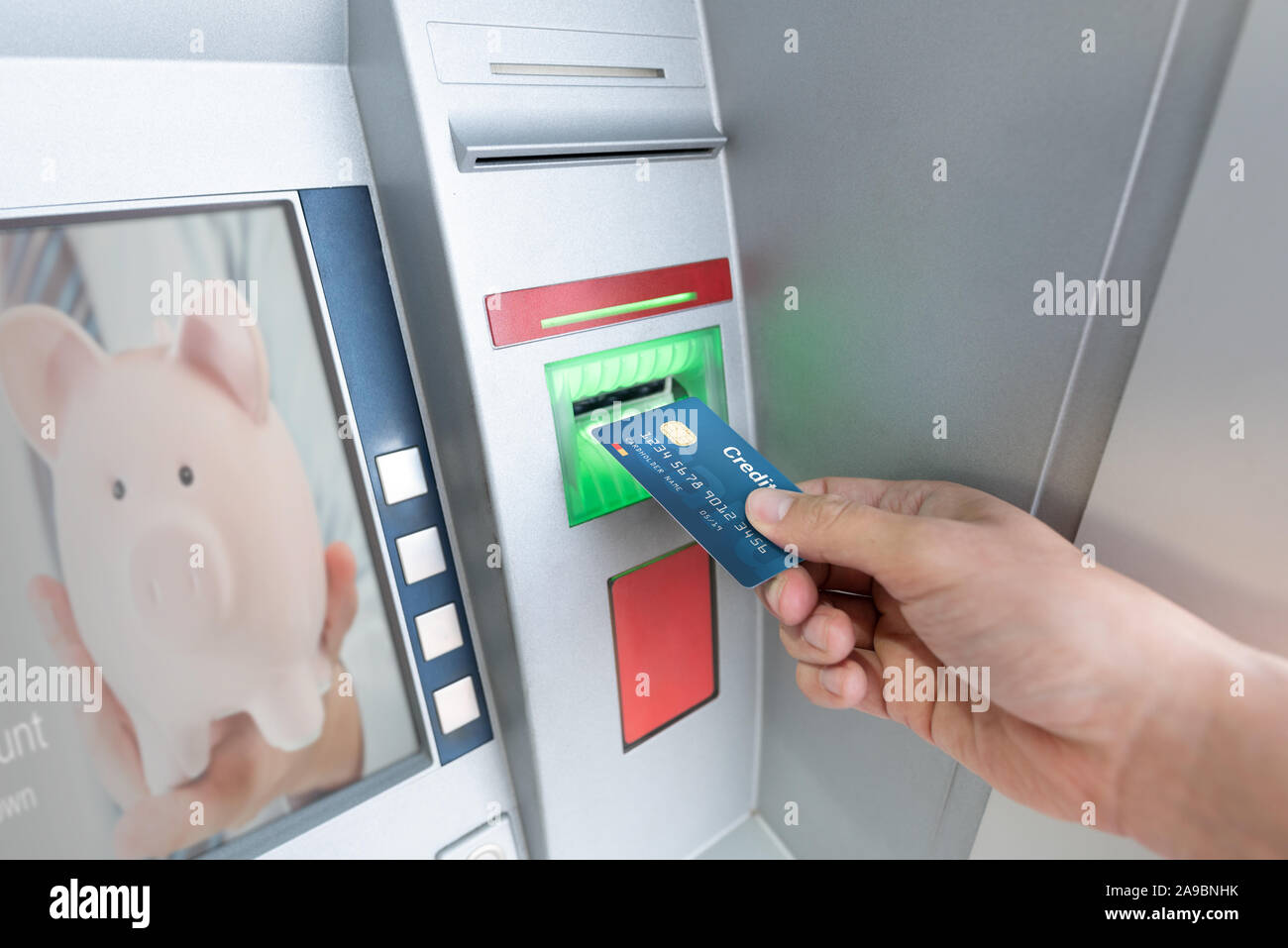 Withdraw money from an ATM using a credit card. ATM close up. Stock Photo