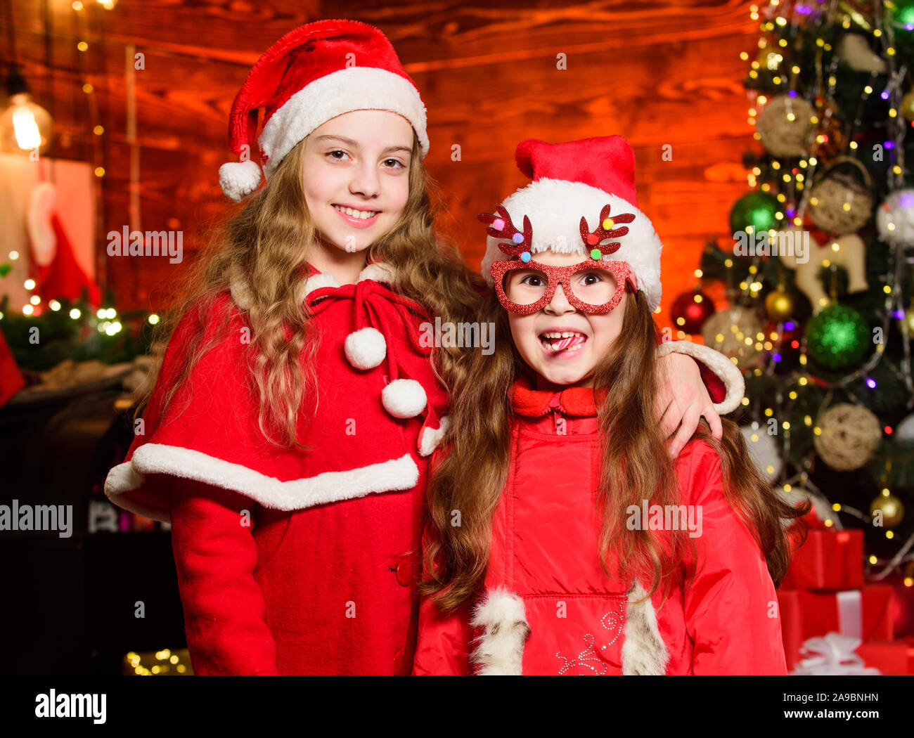 Have Fun Be Jolly And Make Good Cheer For Christmas Comes But Once A Year Cute Girls Sisters Friends Celebrate Christmas At Home Children Join Christmas Carnival Party Waiting For Santa Claus
