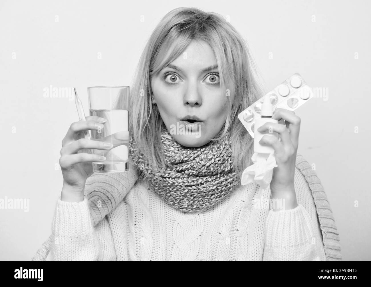 Take pills relieve fever. Drink plenty of fluids. Girl take medicine to