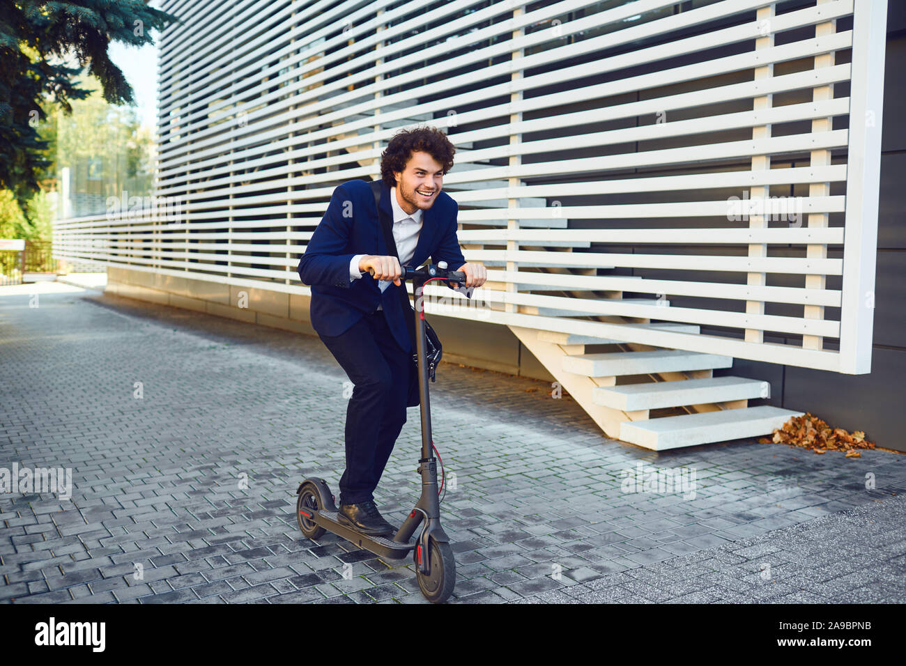 Happy man on scooter hi-res stock photography and images - Alamy