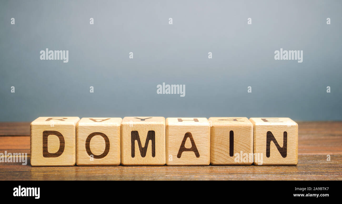 Wooden blocks with the word Domain. Internet address / name of the site, consisting of a set of characters and numbers Stock Photo