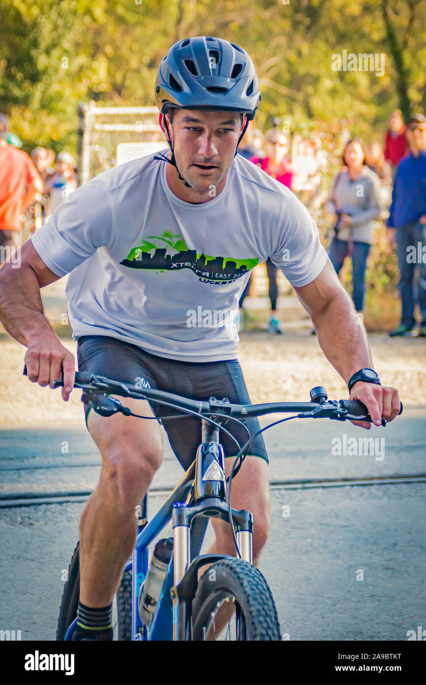 Cyclist competing in the 'King of the James' triathlon. Stock Photo