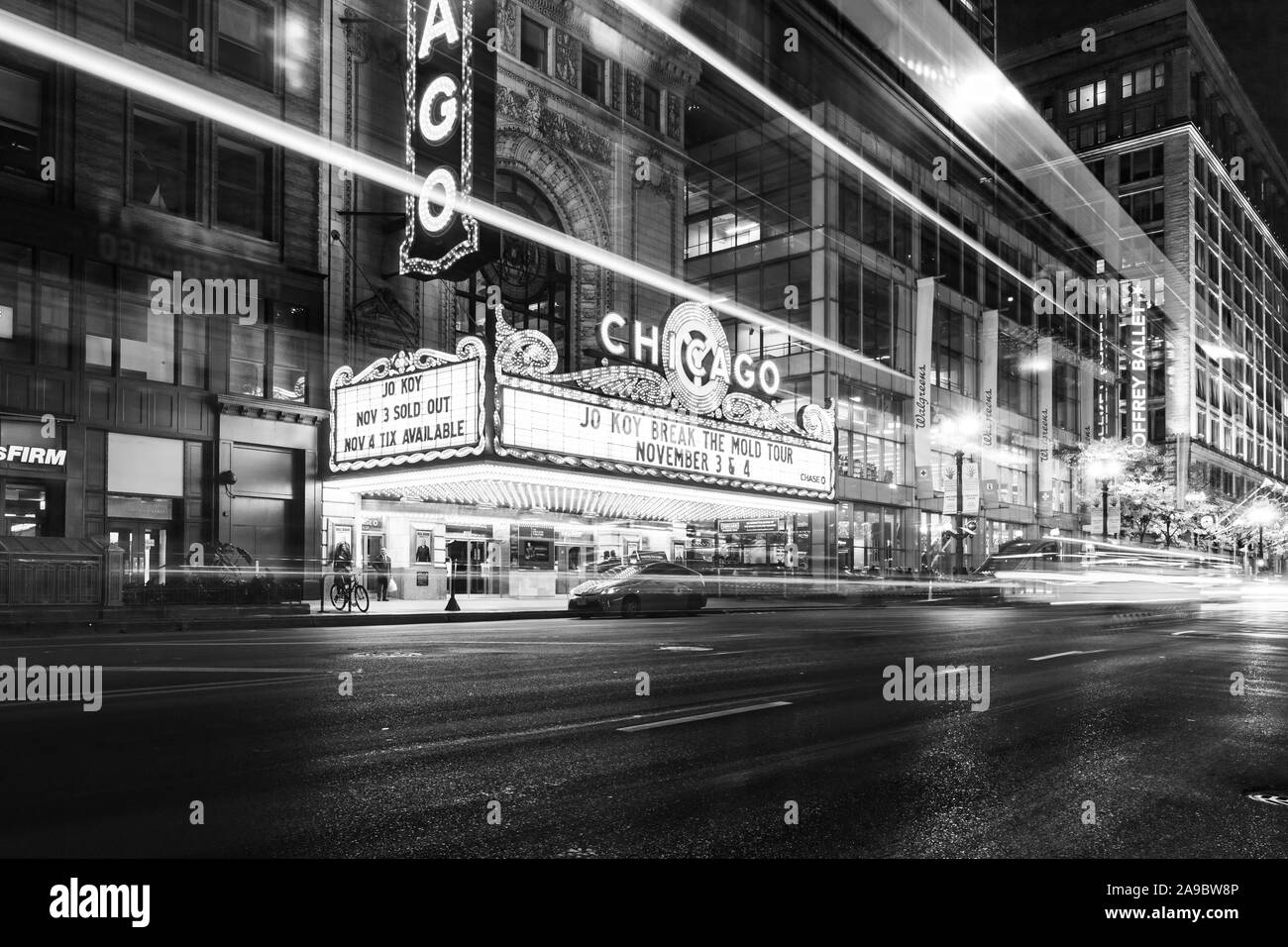 The iconic Chicago Theatre on a cold winter night with a long exposure of vehicles passing by on State Street. Stock Photo