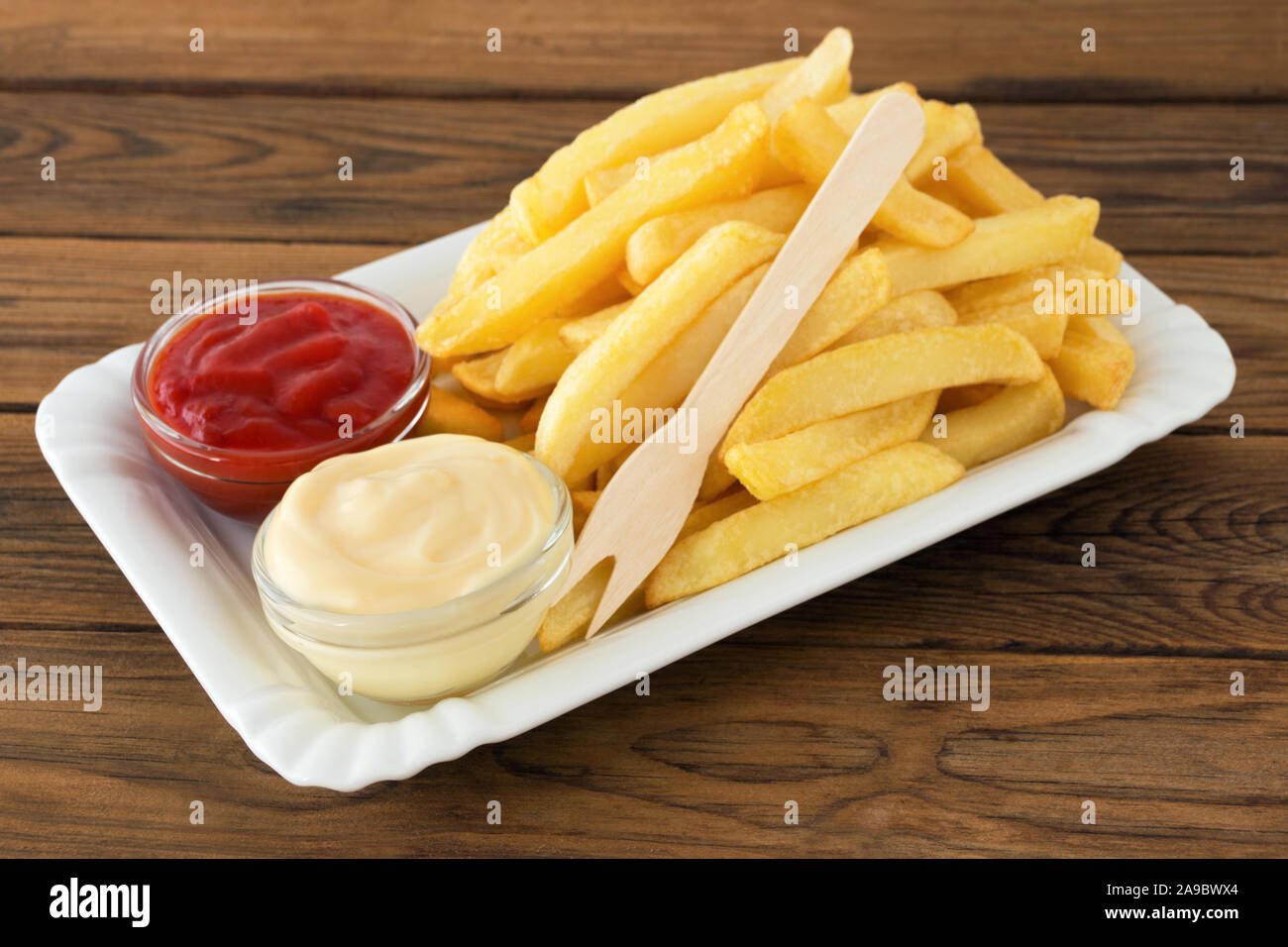 Potato chips and tomato sauce and mayonnaise Stock Photo Alamy