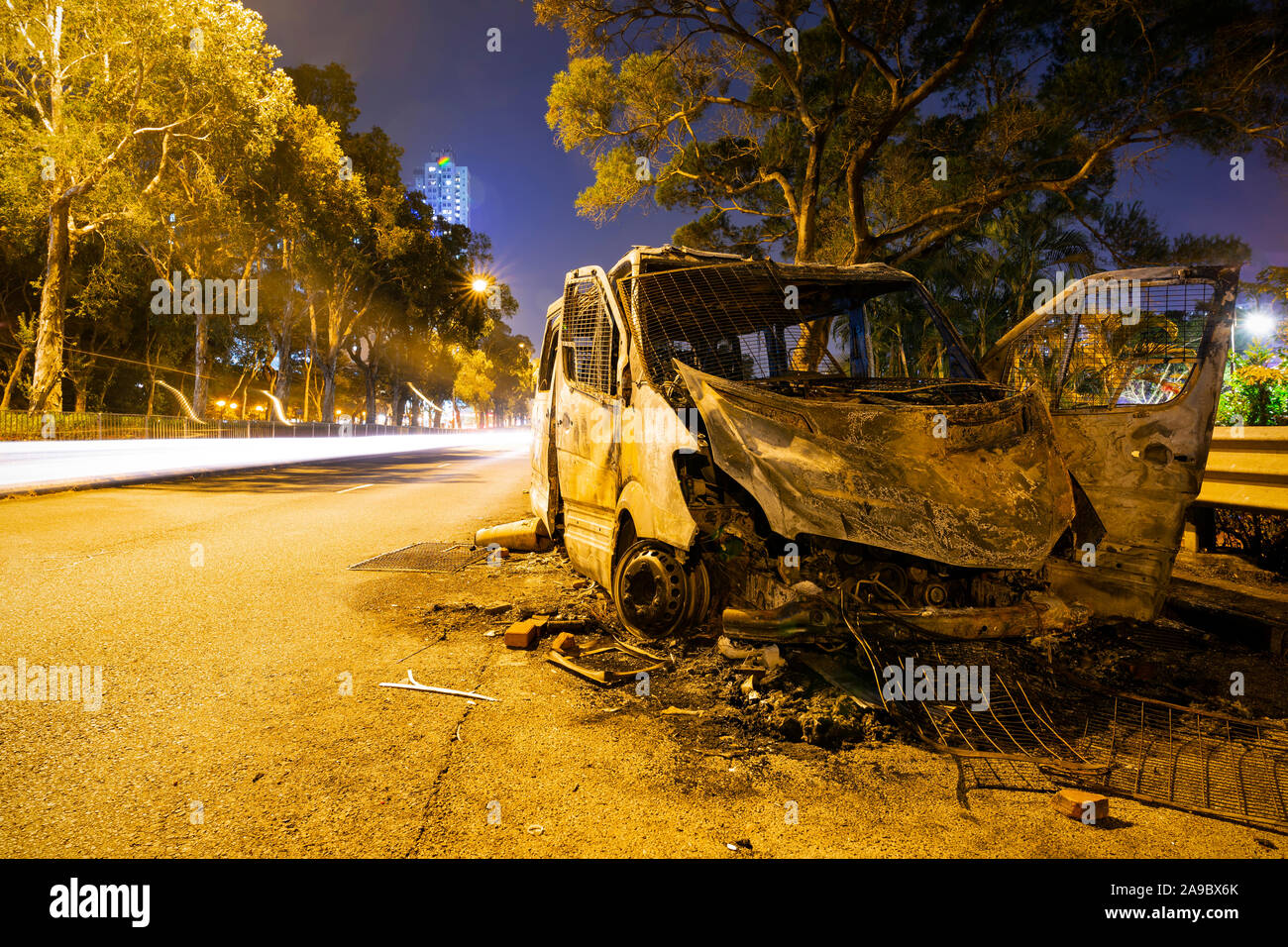 The burnt police vehicle in Hong Kong is completely burnt in the street by the protesters due to the anti-riot demonstration Stock Photo
