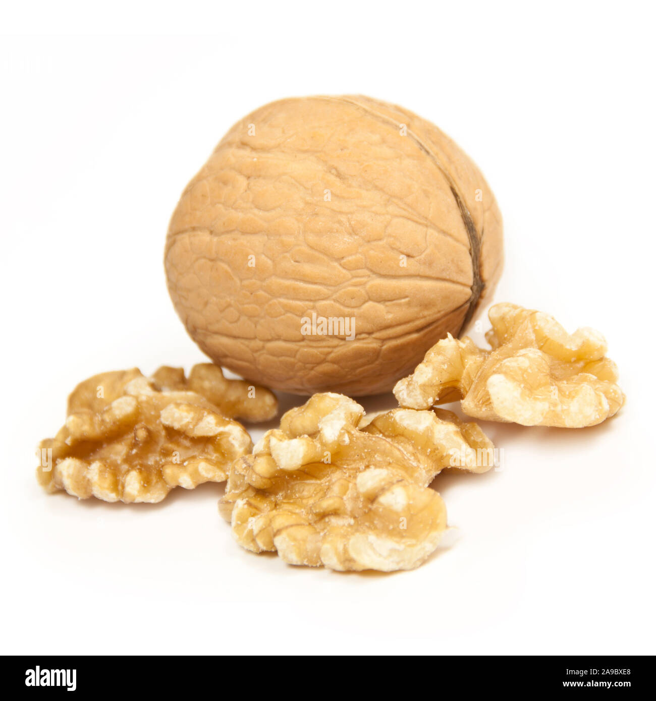 Walnuts against white background close up Stock Photo