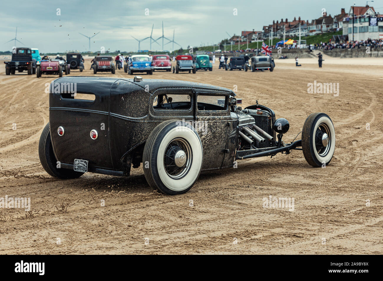 A vintage chopped hot rod at the 'Race the Waves' event, where cars and motorcycles drag race on the beach at Bridlington, East Yorkshire England UK Stock Photo