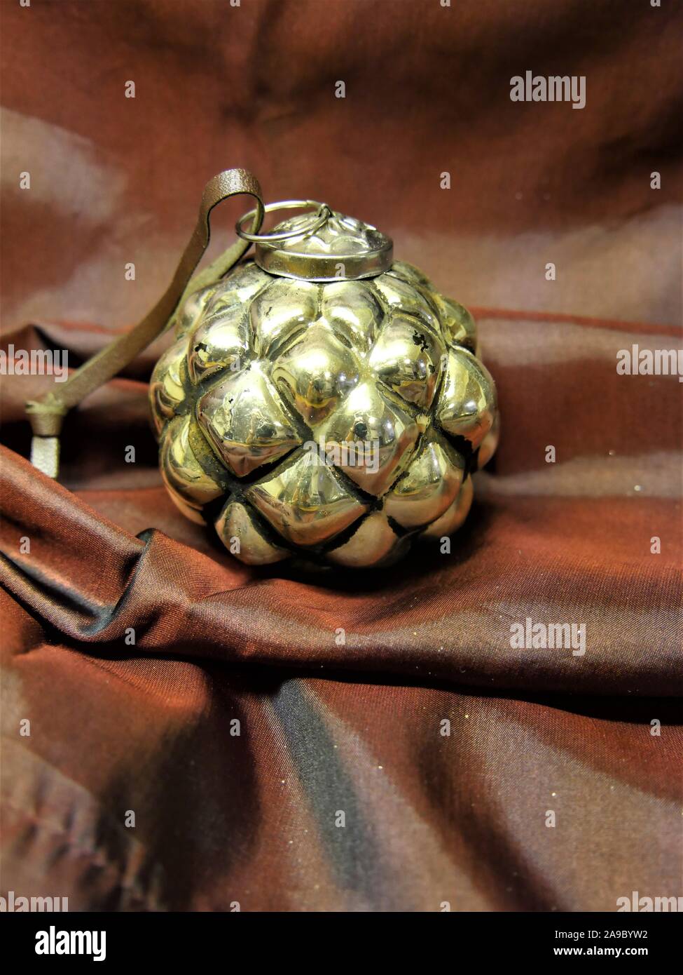 silver christmas bauble on a dark red silver background Stock Photo