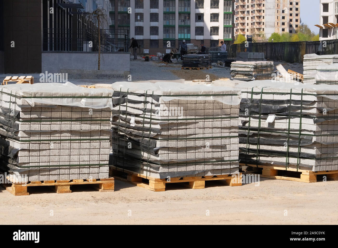 Construction Materials. Building materials for construction of residential complex. Pile of gray bricks at construction site. Stock Photo