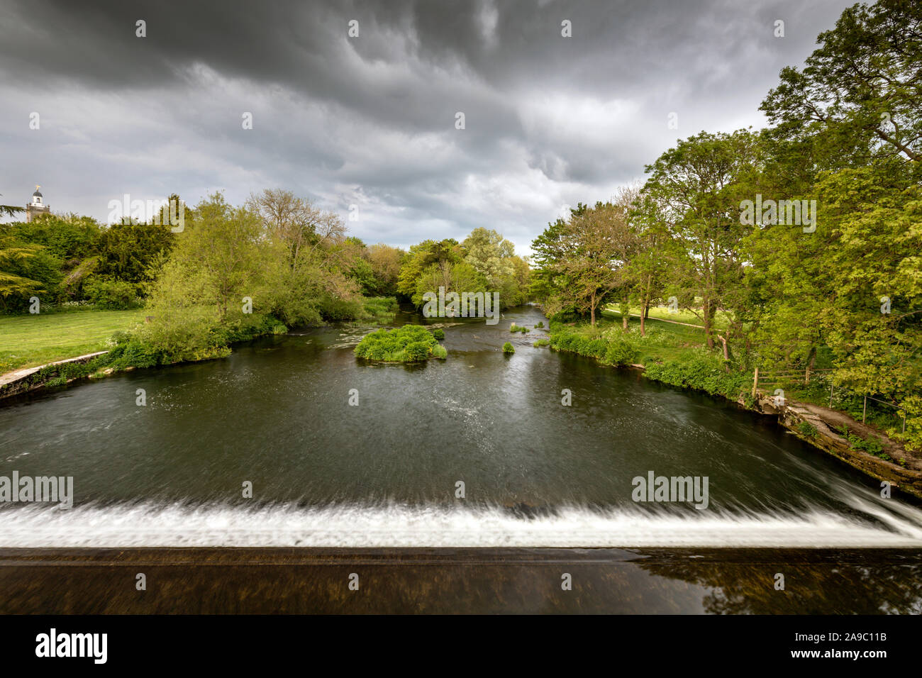 View from the Mortain (blue) bridge over the wier on the River Stour, Blandford Forum, Dorset, England,UK Stock Photo