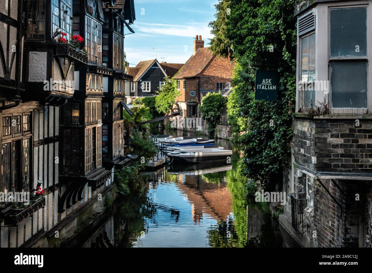 The Weaver's House and boats on the River Stour, which flows through Canterbury, a cathedral city in Kent, southeast England, UK Stock Photo