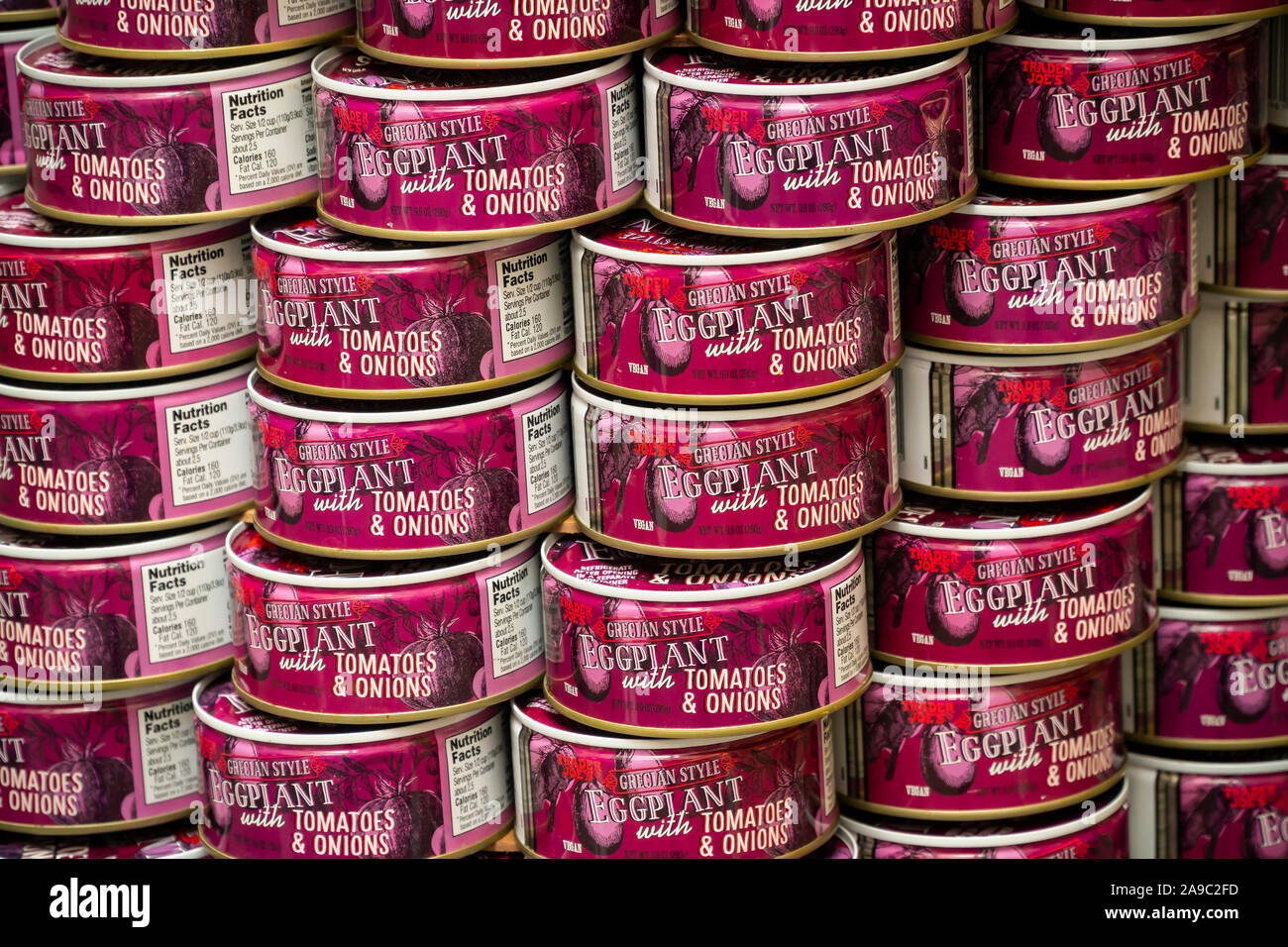 A display of Trader Joe’s brand vegan Grecian style Eggplant cans in