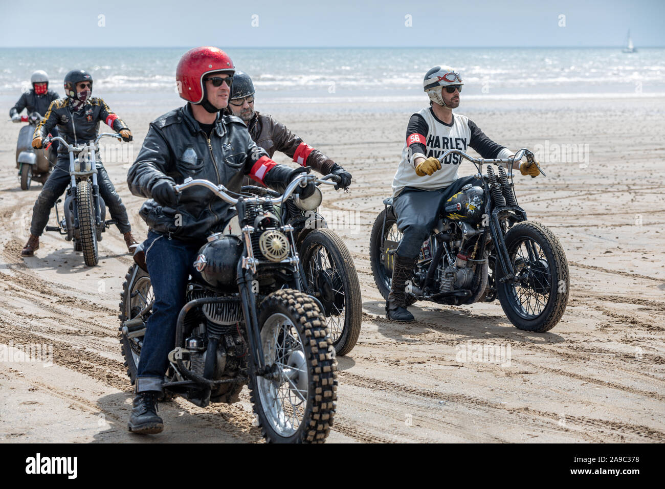 Vintage motorbikes at the 'Race the Waves' event, where cars and motorcycles drag race on the beach at Bridlington, East Yorkshire England UK Stock Photo