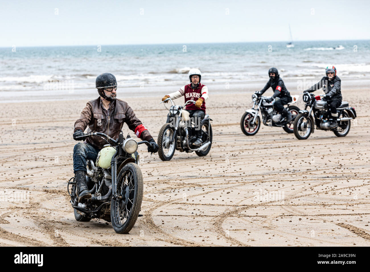 Vintage motorbikes at the 'Race the Waves' event, where cars and motorcycles drag race on the beach at Bridlington, East Yorkshire England UK Stock Photo