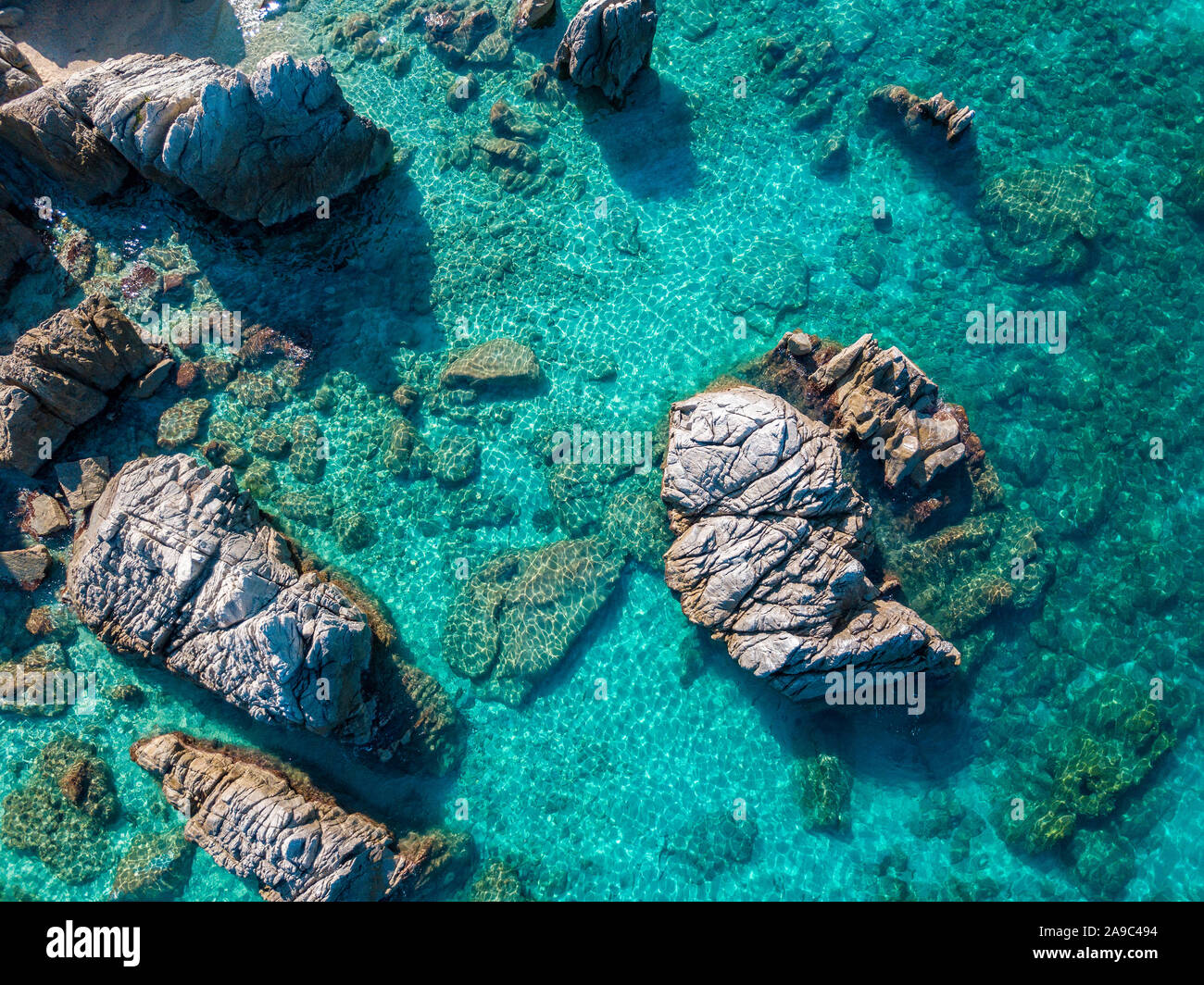 Aerial view of Tropea beach, crystal clear water and rocks that appear ...