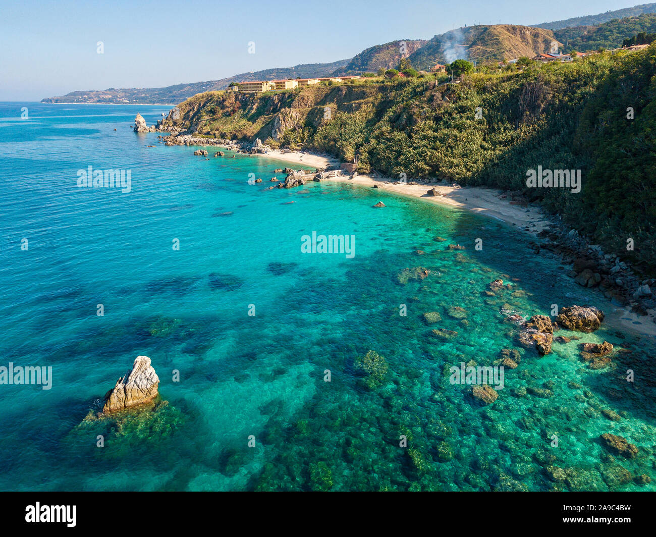 Aerial view of Tropea beach, crystal clear water and rocks that appear ...