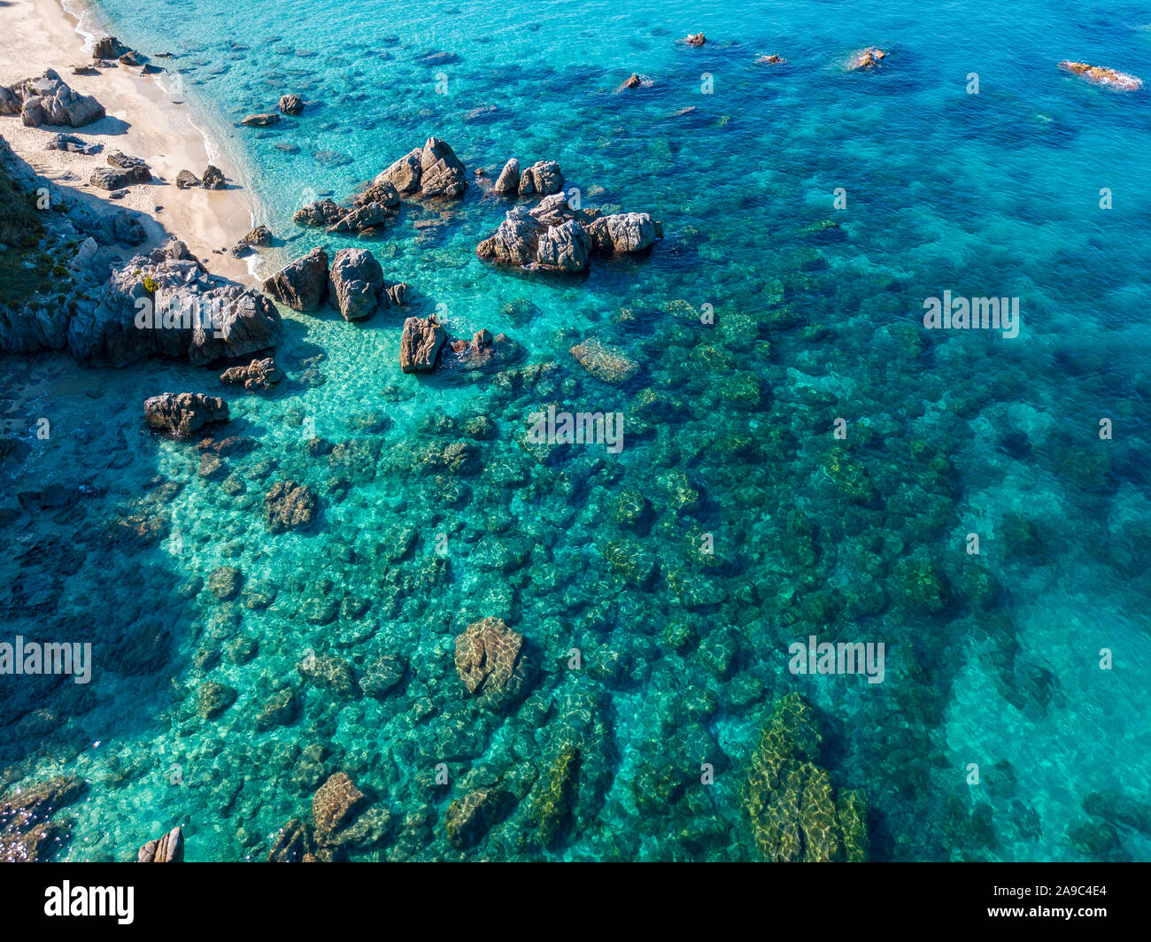 Aerial view of Tropea beach, crystal clear water and rocks that appear ...