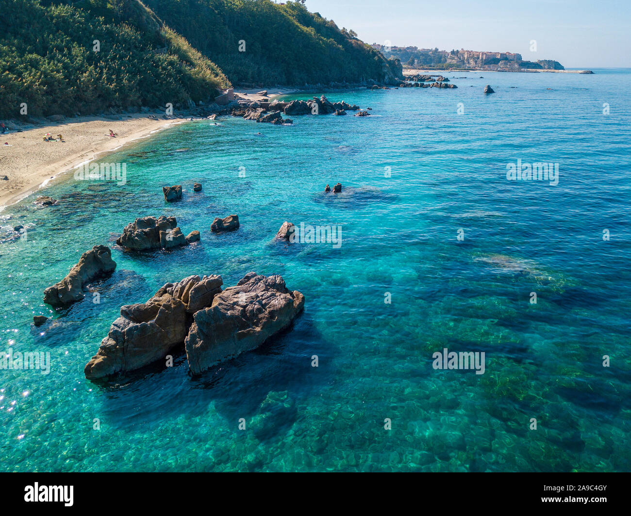 Aerial view of Tropea beach, crystal clear water and rocks that appear ...