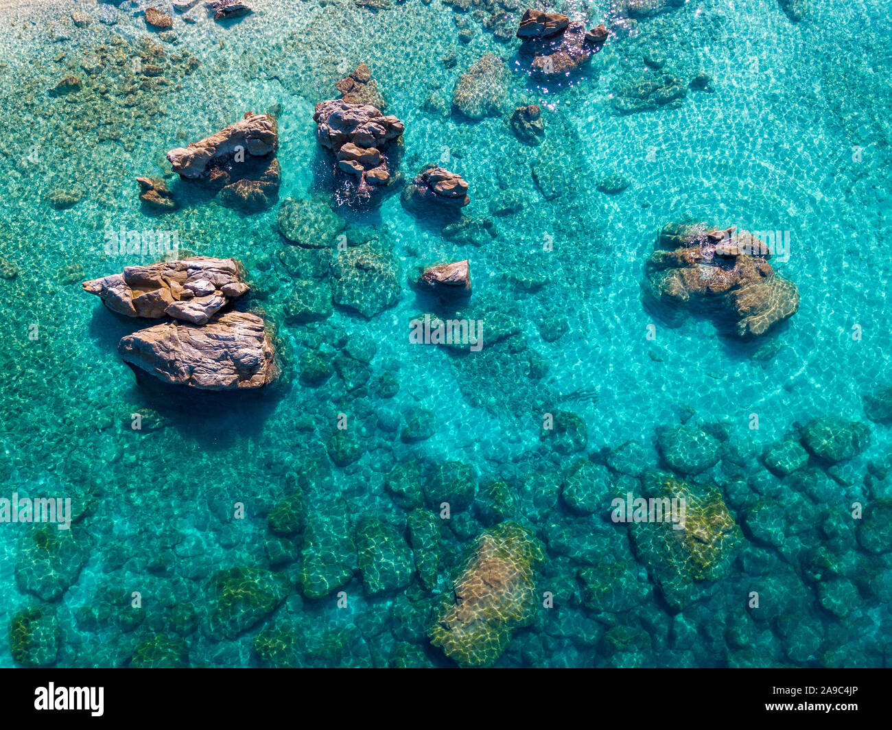 Aerial view of Tropea beach, crystal clear water and rocks that appear ...