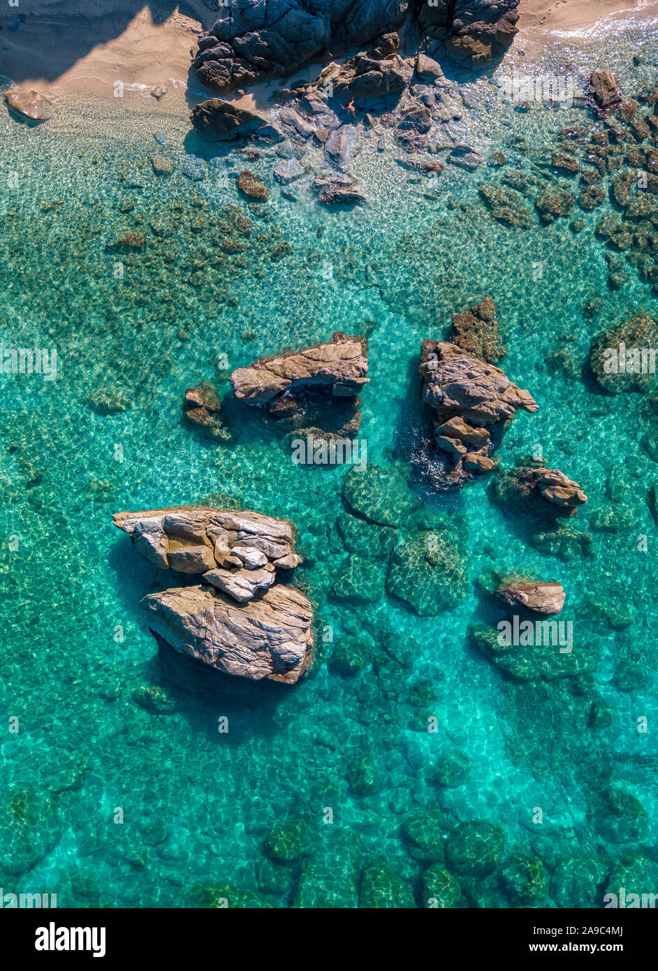 Aerial view of Tropea beach, crystal clear water and rocks that appear ...