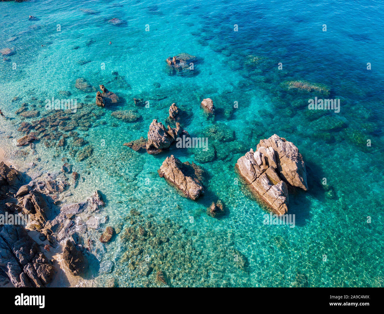Aerial view of Tropea beach, crystal clear water and rocks that appear ...