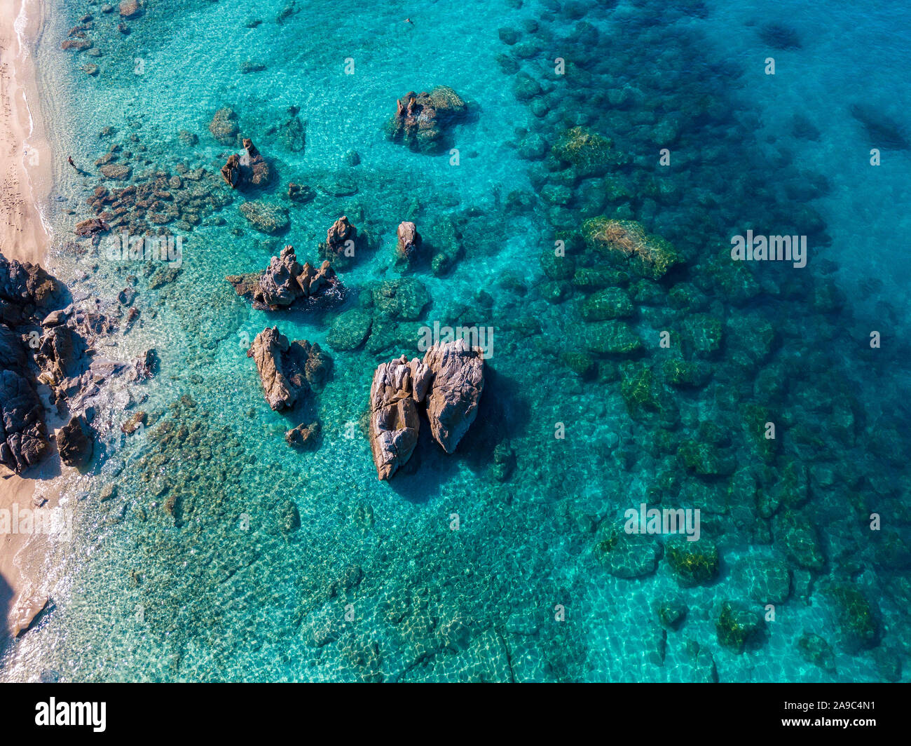 Aerial view of Tropea beach, crystal clear water and rocks that appear ...