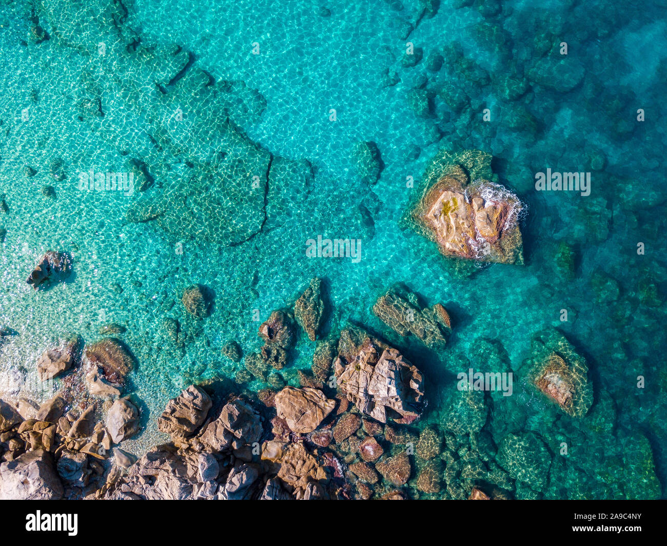 Aerial view of Tropea beach, crystal clear water and rocks that appear ...