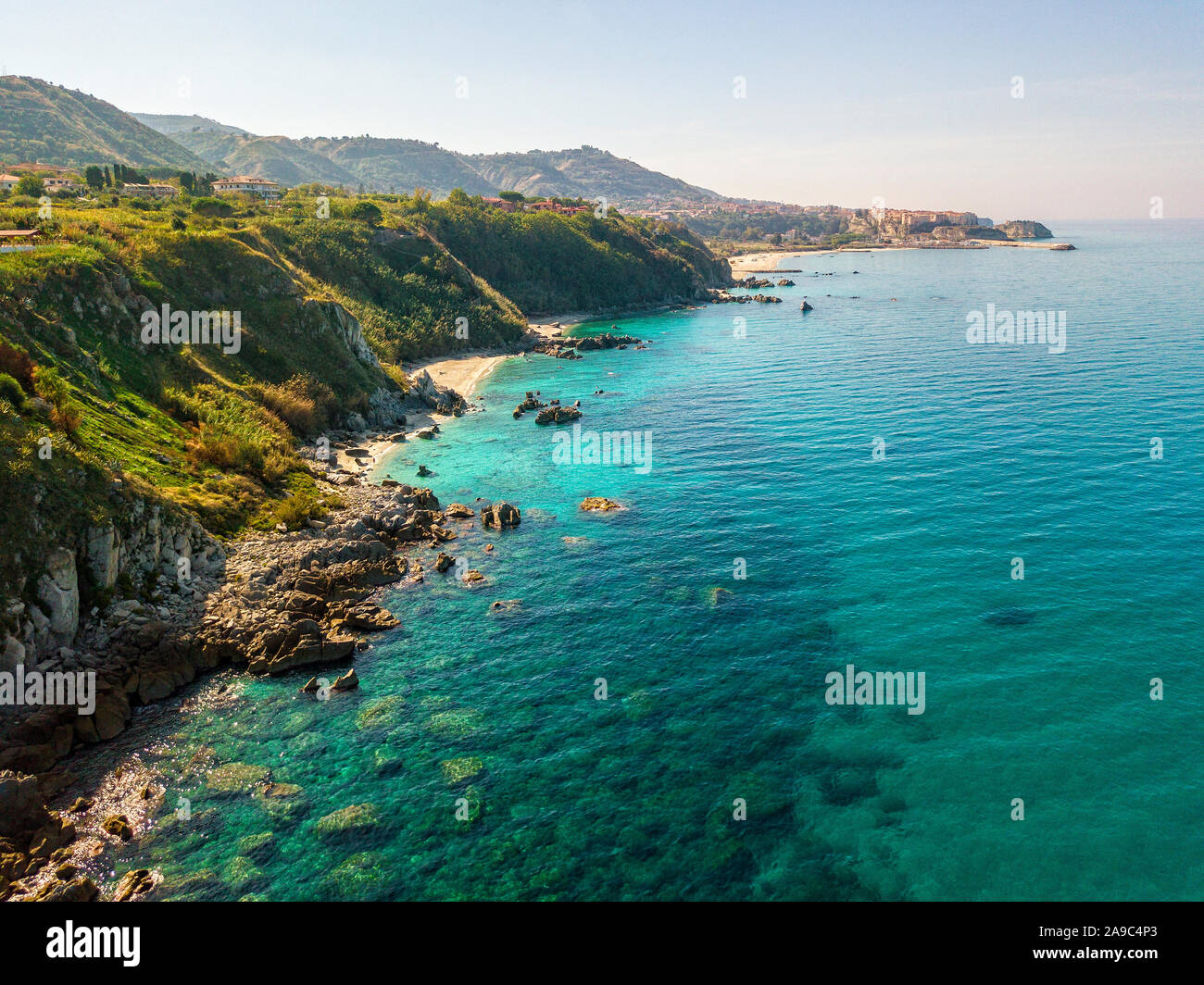 Aerial view of Tropea beach, crystal clear water and rocks that appear ...