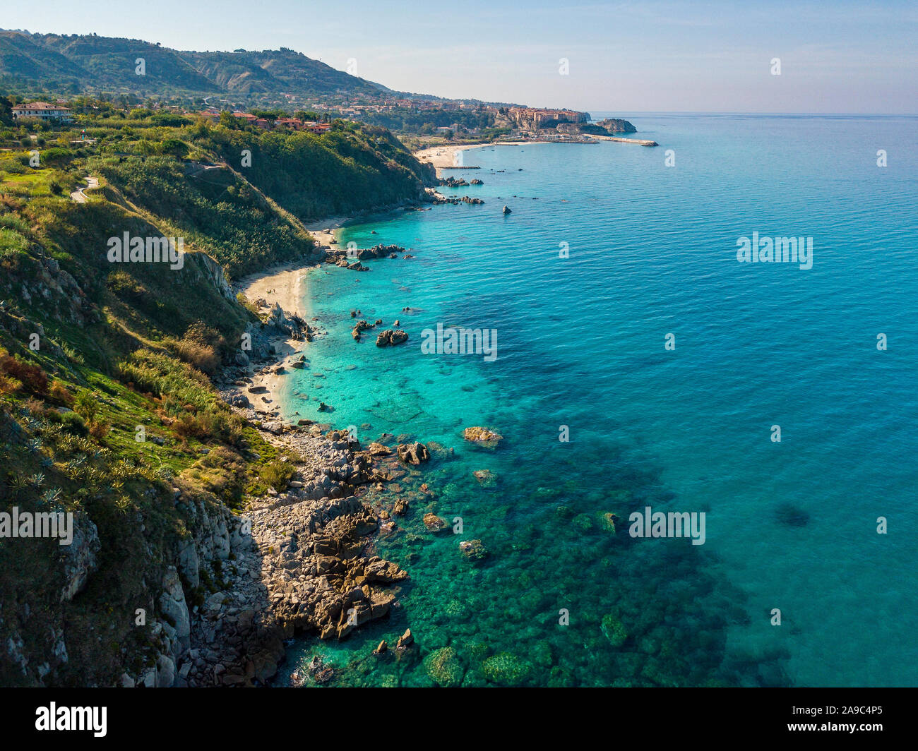 Aerial view of Tropea beach, crystal clear water and rocks that appear ...