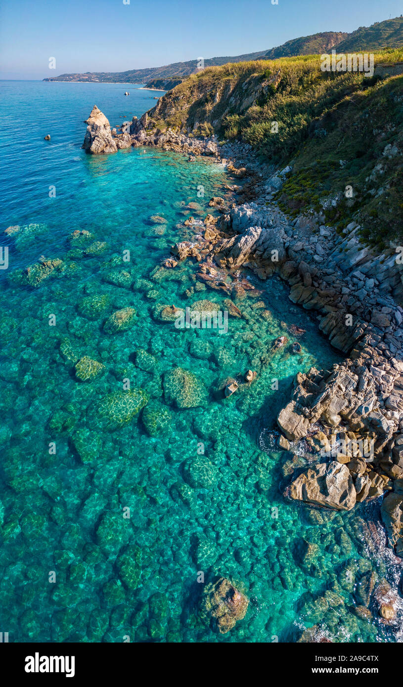Aerial view of Tropea beach, crystal clear water and rocks that appear ...