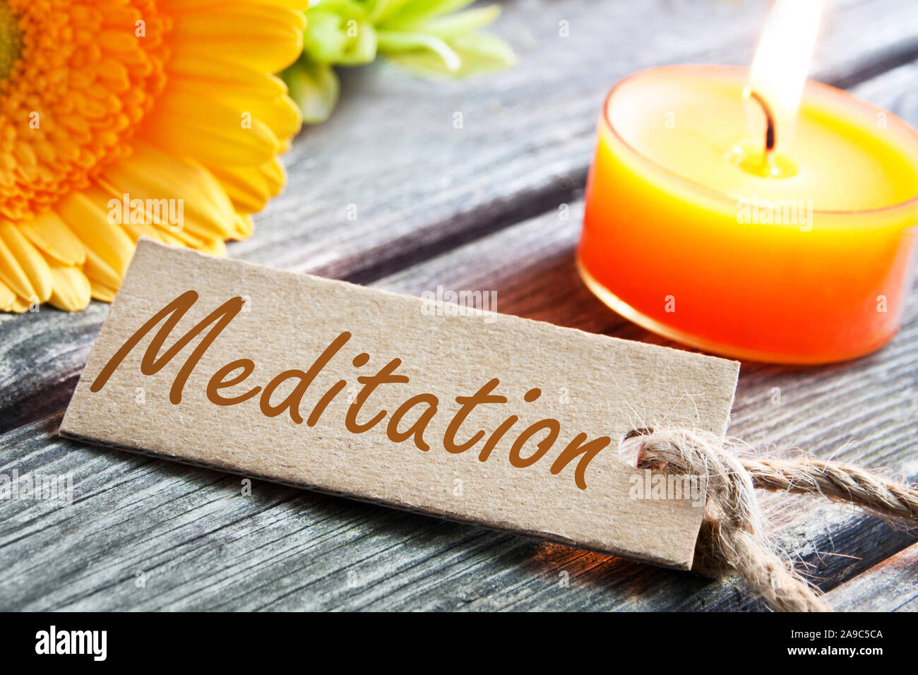 Meditation label and flowers with candle Stock Photo