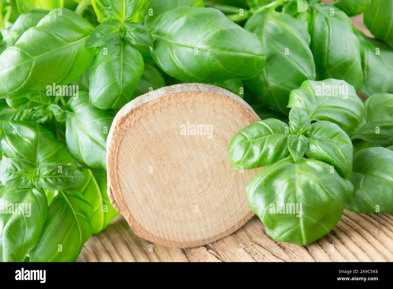Fresh Basil Leaves and wooden label Stock Photo - Alamy