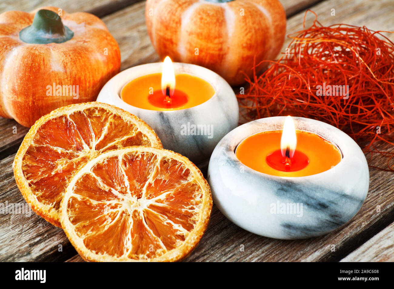 Autumn decorations with candles and pumpkins Stock Photo - Alamy