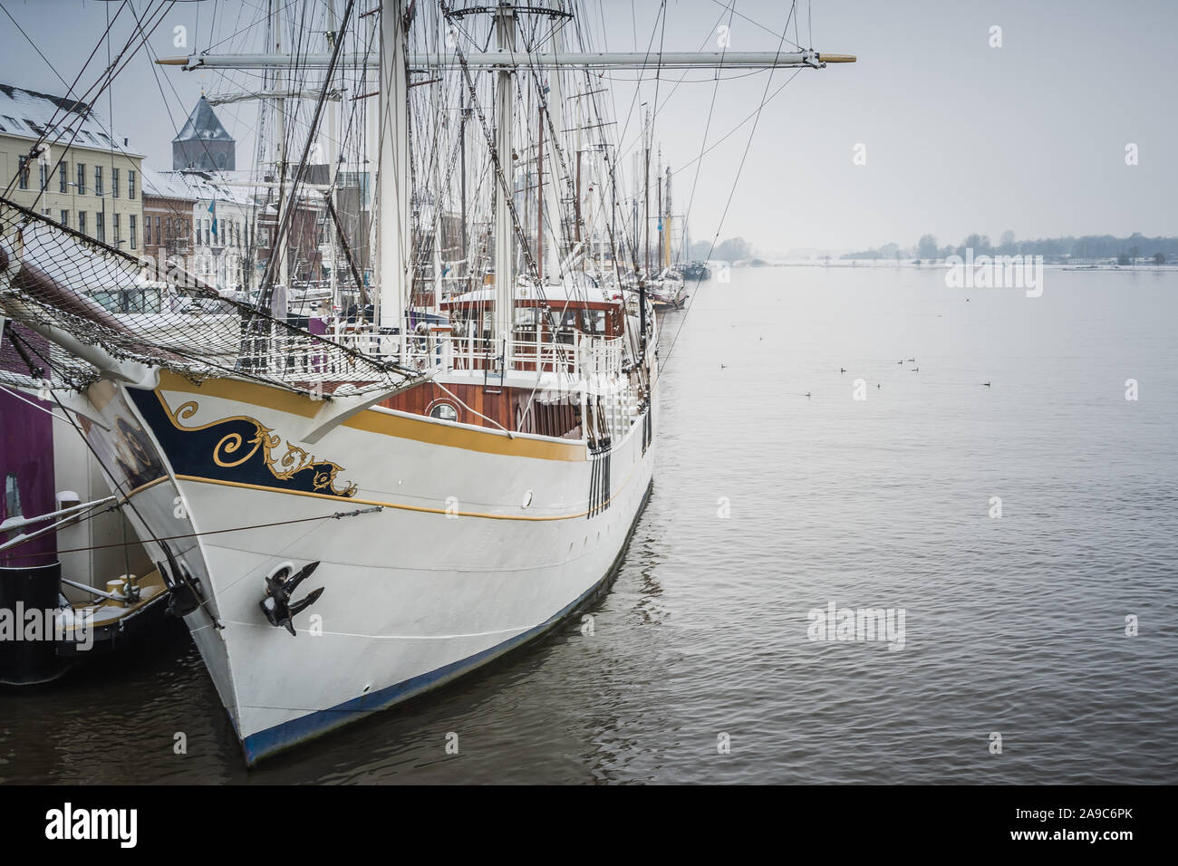 The tallship Stedemaeght in the IJssel rriver during a cold winter morning in Kampen, Netherlands Stock Photo