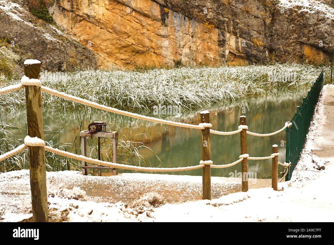 A dusting of snow on the long pond grass and rope fence at Sickle Canyon Stock Photo