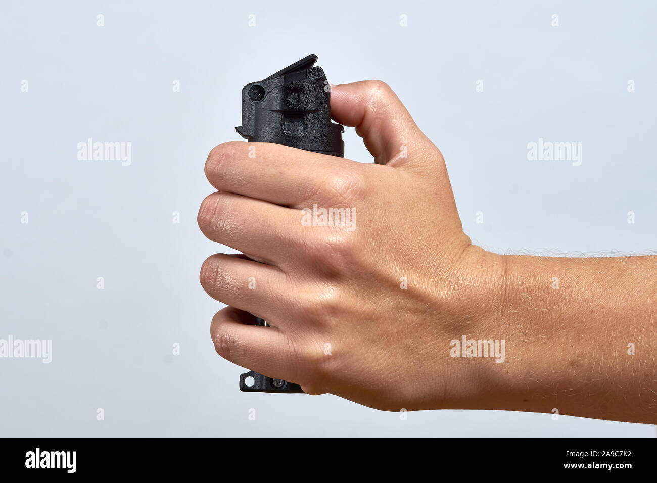 woman aiming pepper spray for defense Stock Photo