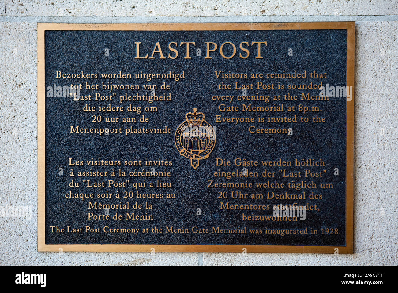 Ypres, Belgium - August 10th 2012: A plaque in four different languages detailing information about the Last Post Ceremony held at the Menin Gate ever Stock Photo
