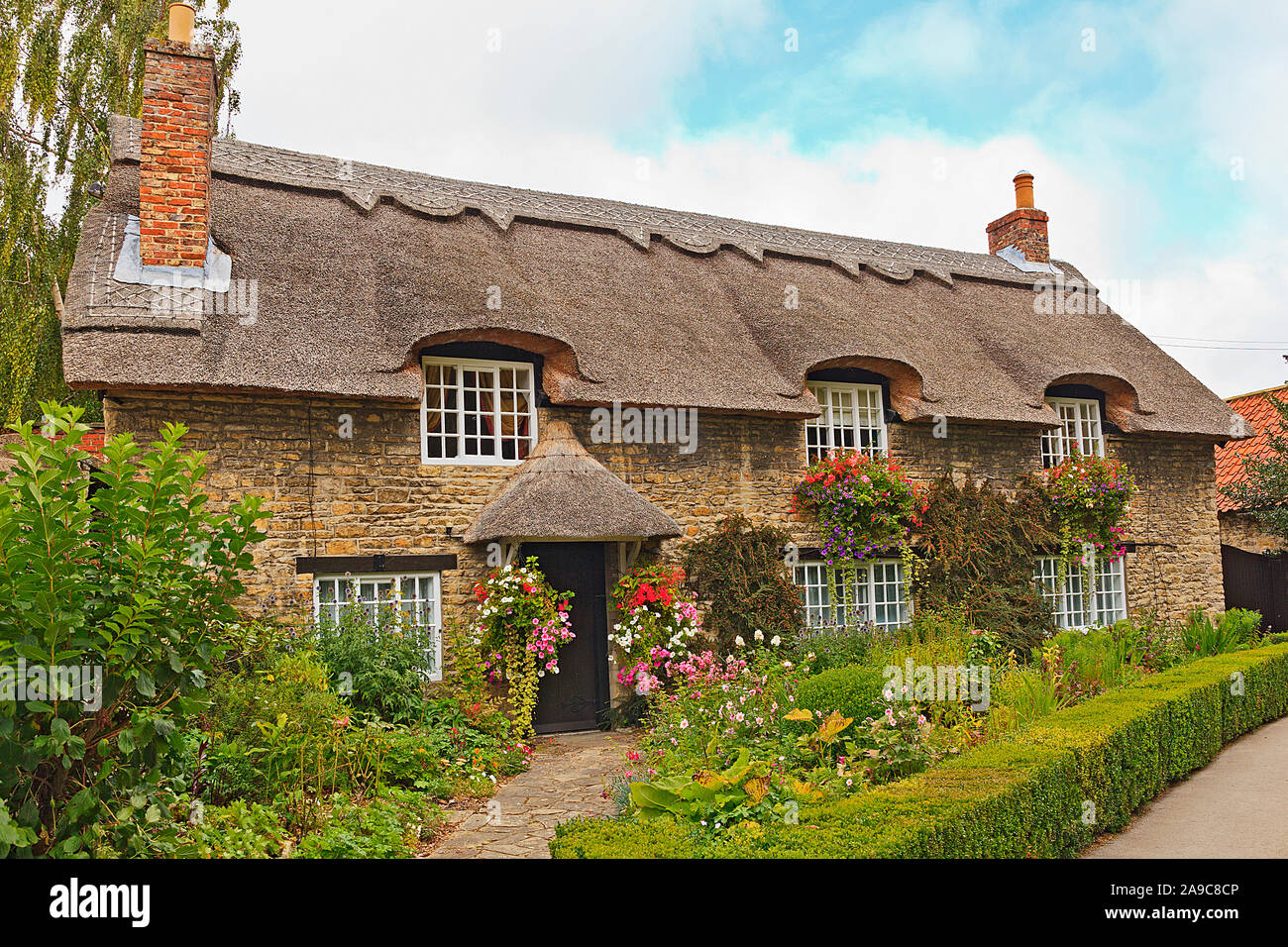 Thatched Cottage by the Beck in ThorntonleDale North Yorkshire Stock