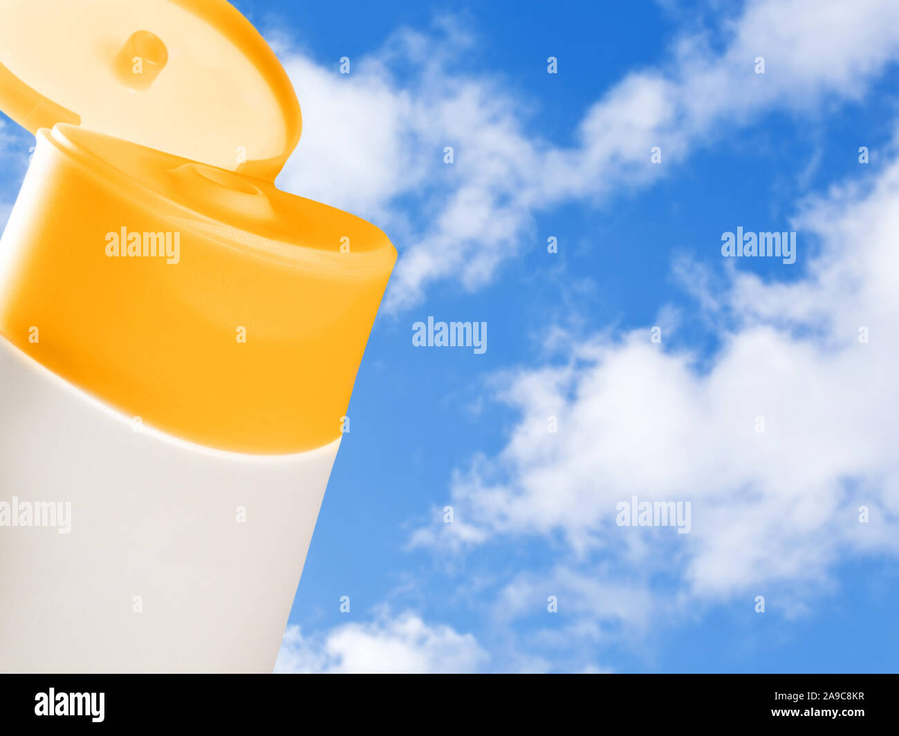 Cosmetic bottle and blue sky background Stock Photo - Alamy