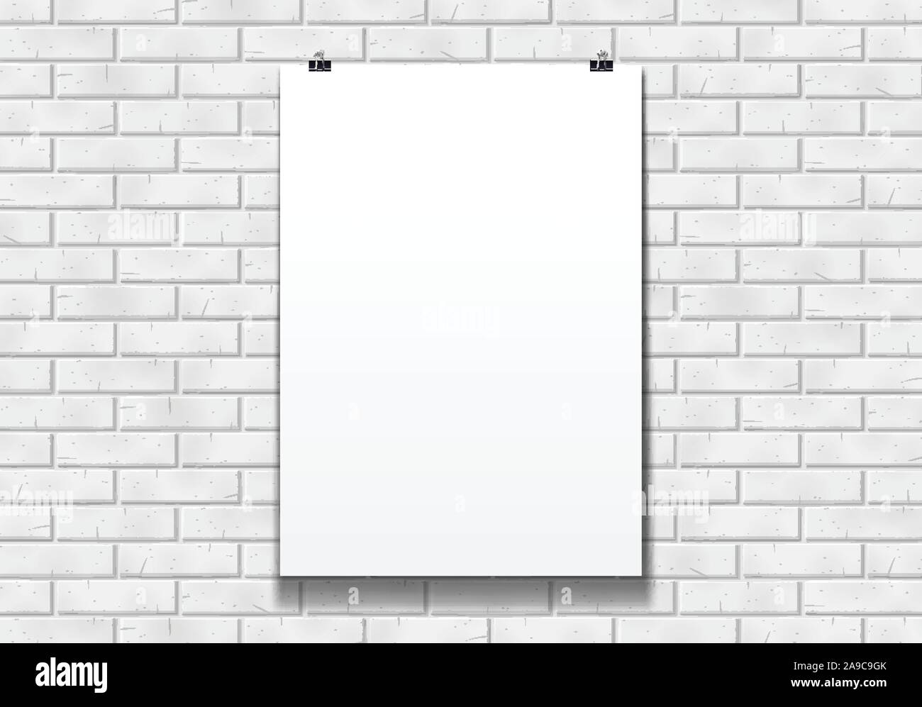 Blank poster mockup on the paper clips in front of brick wall Stock