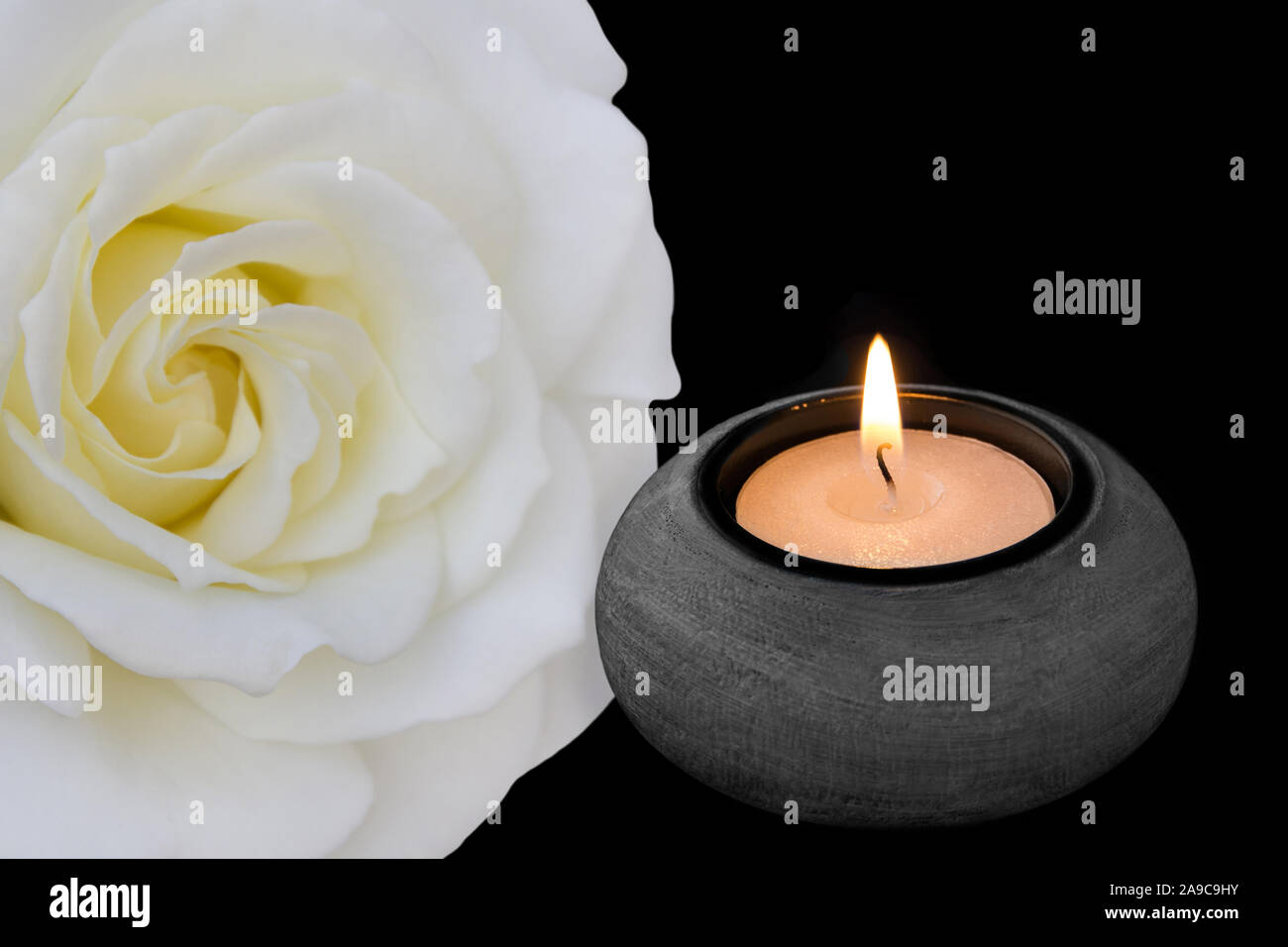 White rose and black background with candle Stock Photo - Alamy