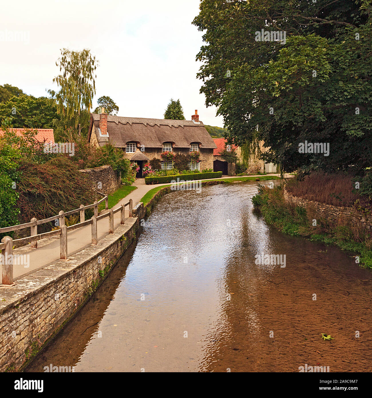 Thatched Cottage by the Beck in ThorntonleDale North Yorkshire Stock