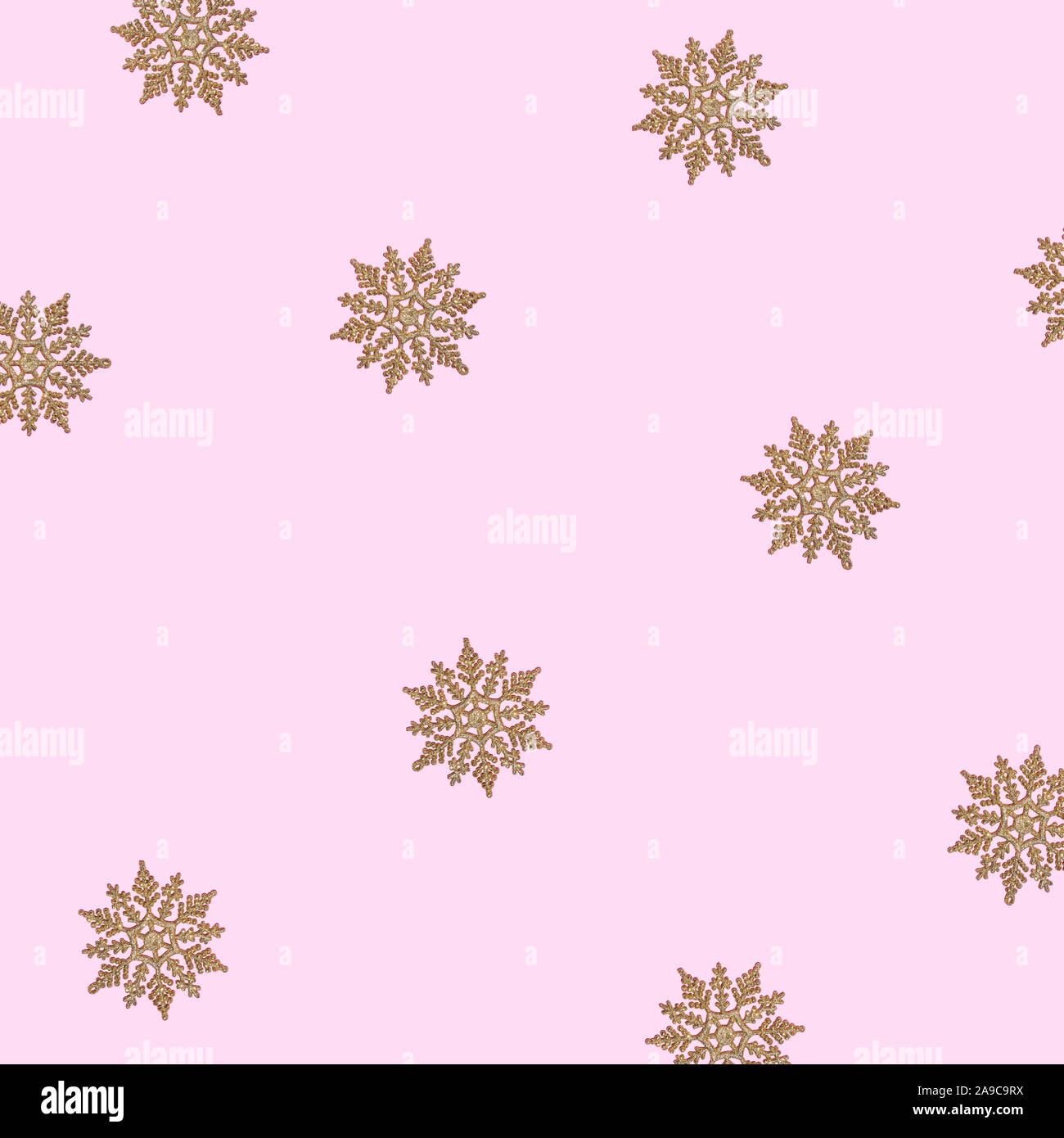 Winter pattern made of snowflakes and on pink background Stock Photo ...