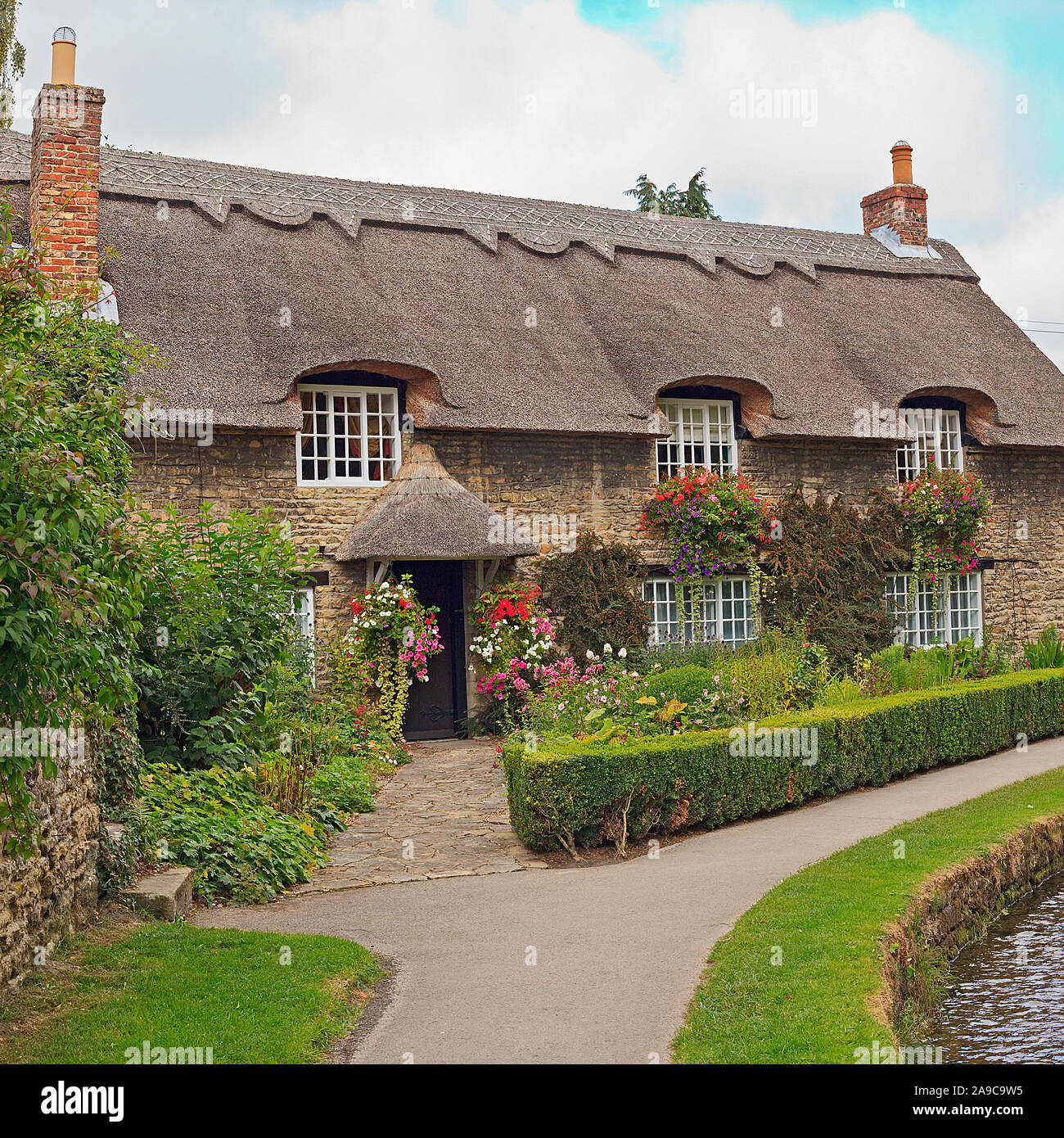 Thatched Cottage by the Beck in ThorntonleDale North Yorkshire Stock