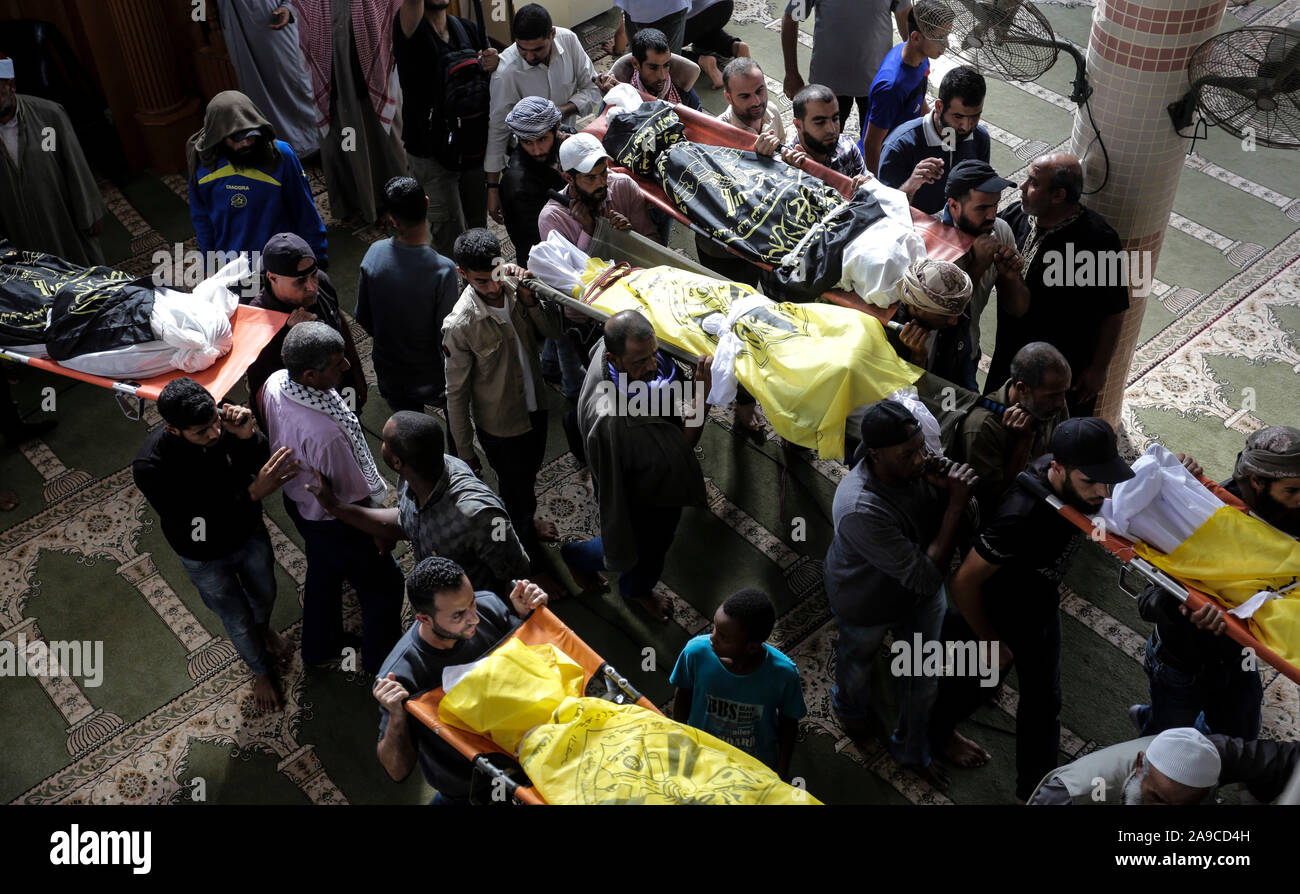 (EDITOR’S NOTE: Image depicts death)Palestinian mourners carry out the bodies of Rasmi Abu Malhous and seven members of his family during their funeral at a mosque in Deir al-Balah, central Gaza Strip. The deceased were killed in an overnight Israeli missile strike that targeted their house. Stock Photo